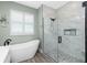 Spacious bathroom with a soaking tub and large glass shower at 1119 Boundary Blvd, Rotonda West, FL 33947
