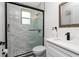 Modern bathroom featuring a marble tiled shower, a sleek vanity, and stylish black fixtures at 1119 Boundary Blvd, Rotonda West, FL 33947