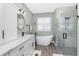 Bright bathroom with stand alone tub, stylish vanity, and glass shower at 1119 Boundary Blvd, Rotonda West, FL 33947