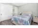 Relaxing bedroom featuring a decorative headboard, beach decor, and spacious closet at 1119 Boundary Blvd, Rotonda West, FL 33947