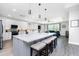 Open-concept kitchen with an expansive island, modern appliances, and seamless living area access at 1119 Boundary Blvd, Rotonda West, FL 33947