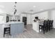Well-designed kitchen with modern finishes, a large island, and direct access to dining area at 1119 Boundary Blvd, Rotonda West, FL 33947