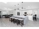 Spacious kitchen featuring a large island with barstool seating, dining area and modern appliances at 1119 Boundary Blvd, Rotonda West, FL 33947
