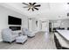 Open-concept living room features hardwood floors, modern fireplace, and contemporary furnishings at 1119 Boundary Blvd, Rotonda West, FL 33947
