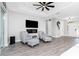Modern living room with sleek flooring, cozy seating, and an electric fireplace at 1119 Boundary Blvd, Rotonda West, FL 33947