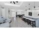 Open floor plan showcasing living area, dining area, and kitchen with breakfast bar at 1119 Boundary Blvd, Rotonda West, FL 33947
