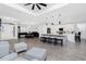 Open-concept living area featuring stylish seating, dining, and a kitchen island with bar stools at 1119 Boundary Blvd, Rotonda West, FL 33947
