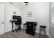 Well lit office features an adjustable desk, rolling chair, and a video game console at 1119 Boundary Blvd, Rotonda West, FL 33947