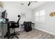 Office features a desk, rolling chair, game console, and a window with plantation shutters at 1119 Boundary Blvd, Rotonda West, FL 33947