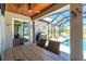 Outdoor dining area with a view of the pool and nearby lake at 1119 Boundary Blvd, Rotonda West, FL 33947