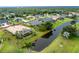 Beautiful home features a pool, lush landscaping and waterfront view at 117 Abercrombie Ave, Englewood, FL 34223