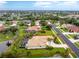 The aerial view showcases beautiful landscaping, lanai, and a calming pond at 117 Abercrombie Ave, Englewood, FL 34223
