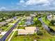 Beautiful aerial view of the property highlighting the landscaping, pool, and canal front location at 117 Abercrombie Ave, Englewood, FL 34223