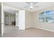 Bright bedroom with tile floors and backyard views is adjacent to the dining room at 117 Abercrombie Ave, Englewood, FL 34223