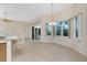 Bright dining area with sliding glass doors to the outside patio at 117 Abercrombie Ave, Englewood, FL 34223