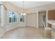 Dining area with chandelier and bay window at 117 Abercrombie Ave, Englewood, FL 34223
