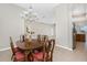 Dining room with view of living room and kitchen at 117 Abercrombie Ave, Englewood, FL 34223