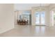 Dining room with natural light and glass front doors at 117 Abercrombie Ave, Englewood, FL 34223