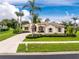 Single-Gathering home featuring mature landscaping and a private driveway at 117 Abercrombie Ave, Englewood, FL 34223