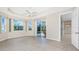 Living room features tile flooring and sliding glass doors that lead to the pool area at 117 Abercrombie Ave, Englewood, FL 34223