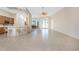 Spacious living room featuring open access to the breakfast bar, and the dining area at 117 Abercrombie Ave, Englewood, FL 34223