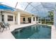 Beautiful screened pool area with ample patio space and inviting outdoor seating at 117 Abercrombie Ave, Englewood, FL 34223