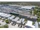Aerial view of waterfront homes with metal roofs, canal access to the gulf, and large marina at 11780 Anglers Club Dr # 107, Placida, FL 33946