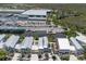 Aerial view of waterfront homes with metal roofs, boat docks, and canal access to the gulf at 11780 Anglers Club Dr # 107, Placida, FL 33946