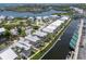 Beautiful aerial view of waterfront homes with canal access to the ocean and nearby island at 11780 Anglers Club Dr # 107, Placida, FL 33946