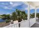 Enjoy the view of the lake and the tropical landscape from this railed balcony at 11780 Anglers Club Dr # 107, Placida, FL 33946