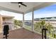 Enjoy the waterfront views from this covered balcony with white pillars and wood-look flooring at 11780 Anglers Club Dr # 107, Placida, FL 33946