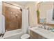 Cozy bathroom featuring a vanity with modern sink, tiled shower, and neutral wall color at 11780 Anglers Club Dr # 107, Placida, FL 33946
