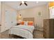 Comfortable bedroom with soft lighting, a ceiling fan, and a cozy bed with decorative pillows at 11780 Anglers Club Dr # 107, Placida, FL 33946