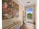 Bright foyer with stylish decor, hardwood floors, and an open doorway overlooking the lake at 11780 Anglers Club Dr # 107, Placida, FL 33946