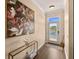 Inviting foyer with stylish decor, artwork, hardwood floors, and a view to a waterfront vista at 11780 Anglers Club Dr # 107, Placida, FL 33946