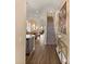 Welcoming interior with hardwood floors, staircase, artwork, and an open floor plan at 11780 Anglers Club Dr # 107, Placida, FL 33946