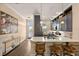 Well-designed kitchen with a breakfast bar, stylish seating, and modern appliances at 11780 Anglers Club Dr # 107, Placida, FL 33946