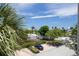 Lush, tropical landscaping surrounds this resort-style property, captured from a balcony view at 11780 Anglers Club Dr # 107, Placida, FL 33946