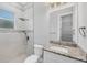 Modern bathroom featuring marble-look tile, a glass enclosed shower, and granite countertops at 123 Ferdon Cir, Port Charlotte, FL 33954