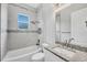 Bathroom featuring a shower and bathtub combination, sink, toilet and window at 123 Ferdon Cir, Port Charlotte, FL 33954