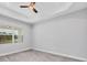Spacious bedroom features a window with outside view, wood-look flooring and neutral walls at 123 Ferdon Cir, Port Charlotte, FL 33954