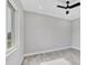 This bedroom features a ceiling fan, recessed lights and a large window at 123 Ferdon Cir, Port Charlotte, FL 33954
