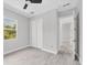 Bedroom with natural light, wood-look flooring, a ceiling fan, and closet at 123 Ferdon Cir, Port Charlotte, FL 33954