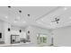 Modern kitchen featuring stainless steel appliances, a breakfast bar, and stylish pendant lighting at 123 Ferdon Cir, Port Charlotte, FL 33954