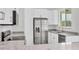 Well-equipped kitchen featuring stainless steel appliances, a granite countertop, and abundant cabinet space at 123 Ferdon Cir, Port Charlotte, FL 33954