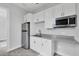 Kitchenette featuring stainless steel appliances, cabinets and stone countertops at 123 Ferdon Cir, Port Charlotte, FL 33954