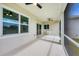 Covered lanai with ceiling fans, windows and screened openings at 123 Ferdon Cir, Port Charlotte, FL 33954