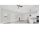 Open-concept living space with abundant natural light, access to a kitchen and views of the outdoors at 123 Ferdon Cir, Port Charlotte, FL 33954