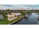 Luxury waterfront property with a private dock, pool, and screened lanai, offering luxurious outdoor living at 12438 Prather Ave, Port Charlotte, FL 33981