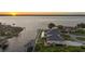Waterfront home with boat lift, set among well-maintained grounds, offering convenience and serenity at 12438 Prather Ave, Port Charlotte, FL 33981